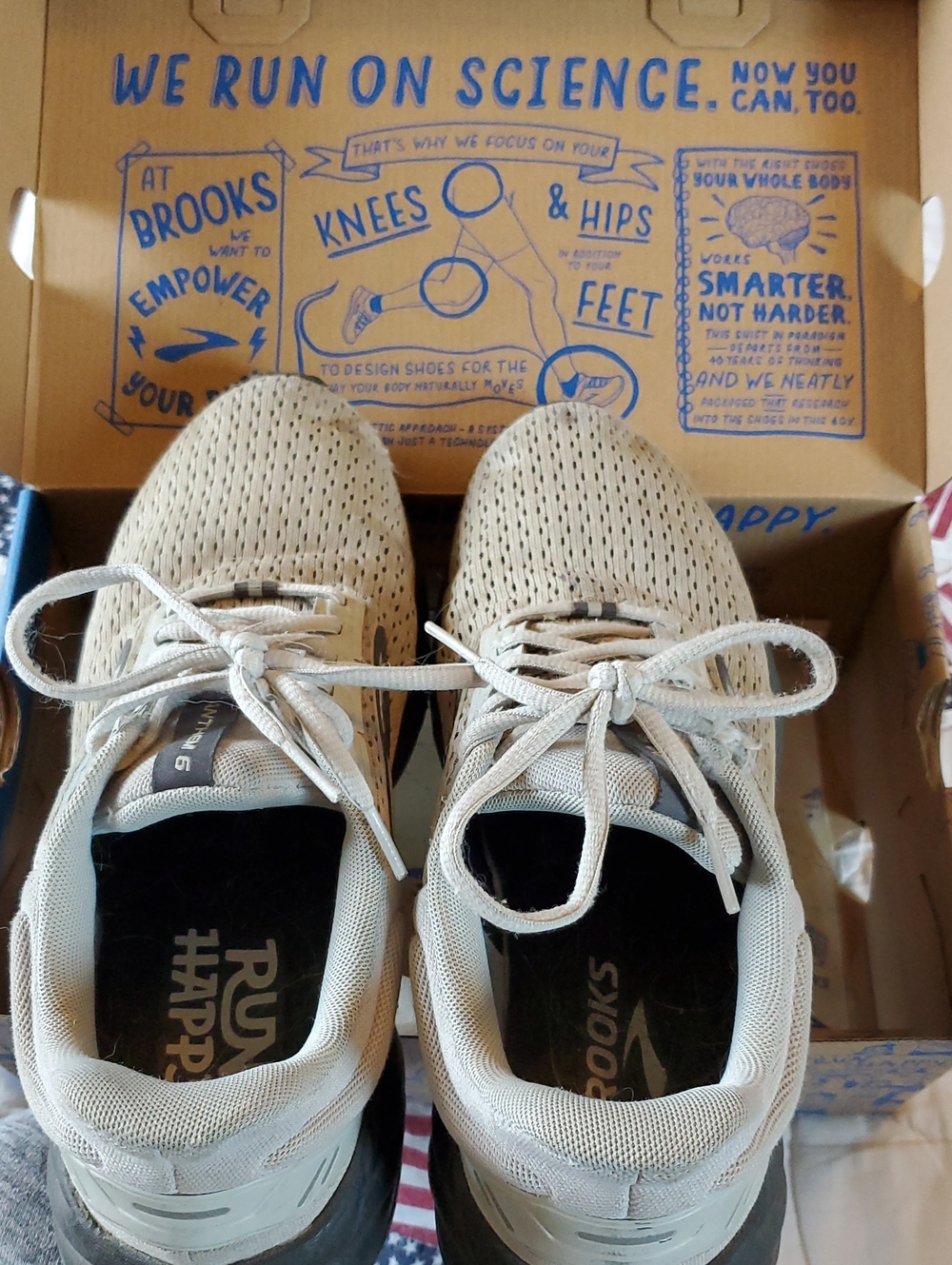 Brooks beige and white running shoes